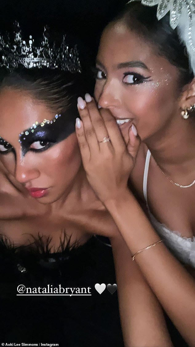 Duo: Aoki Lee Simmons and Natalia Bryant coordinated as Black Swan characters
