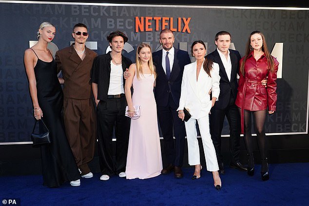 The penultimate photo: Finally came the photo of David posing with Mia Regan, Romeo, Cruz, Harper, Victoria and Brooklyn at the BECKHAM premiere