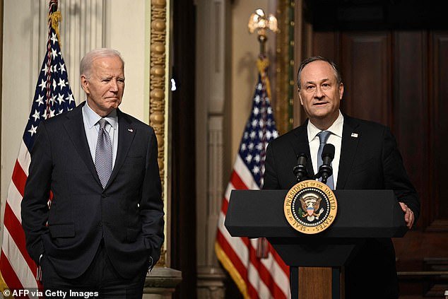 US President Joe Biden listens as Second Gentleman Doug Emhoff speaks at a roundtable with Jewish community leaders in the Indian Treaty Room of the White House on October 11, 2023.  (Photo by Brendan SMIALOWSKI / AFP) (Photo by BRENDAN SMIALOWSKI/AFP via Getty Images)