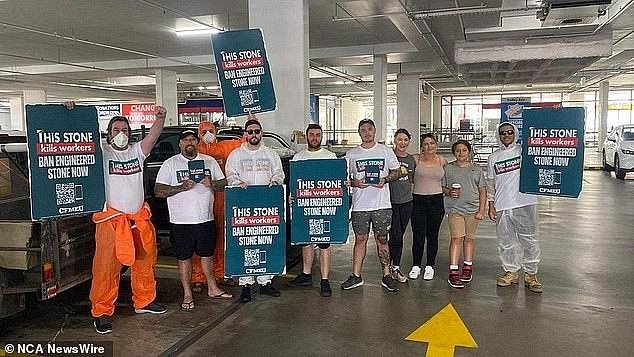 Union members (pictured) have staged protests outside Bunnings stores across Australia, demanding the retailer stop selling stone worktops