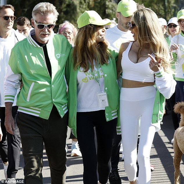 Chloe Latanci, 38, (right) put on a brave face as she attended her mother Olivia Newton-John's annual Walk for Health in Melbourne at Alexandra Gardens on Sunday.  Pictured with John Easterling (left) and Totie Goldsmith (centre)