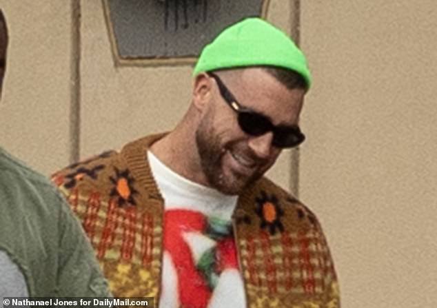 Travis Kelce, wearing a fluorescent green hat, heads to Mile High to face the Broncos
