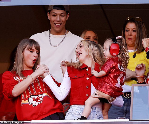 Secret handshake: Patrick's wife Brittany Mahomes, 28, has also become fast friends with the Bad Blood hitmaker, with the ladies already having their own celebratory handshake