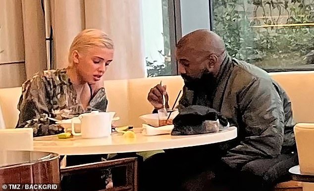 Kanye West and his wife Bianca Censori were the picture of domestic bliss in their very first public photo as a married couple – which was taken just weeks after the couple tied the knot