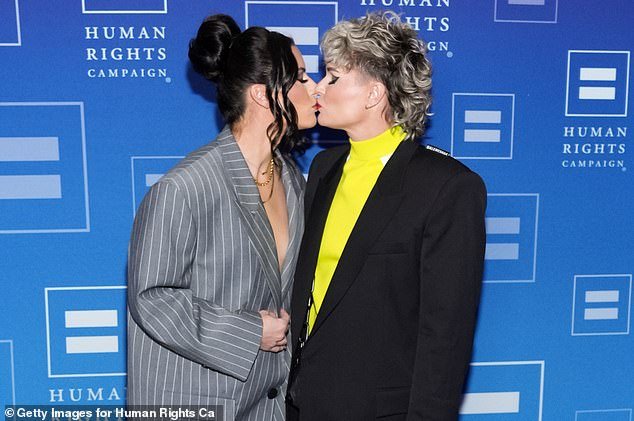USWNT stars Ashlyn Harris and Ali Krieger - pictured together in February - divorce after four years of marriage