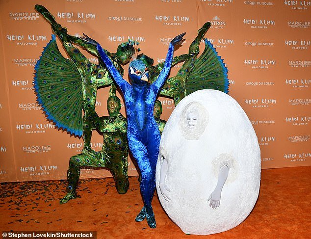 Peacock egg?  She stood next to her husband Tom Kaulitz, 34, who was dressed like a large white egg
