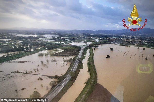 This photo was taken and distributed on November 3, 2023 by the Vigili del Fuoco, the Italian Corps.  of Firefighters, shows aerial photos of the flooding around Prato in Tuscany after heavy rain due to Storm Ciara