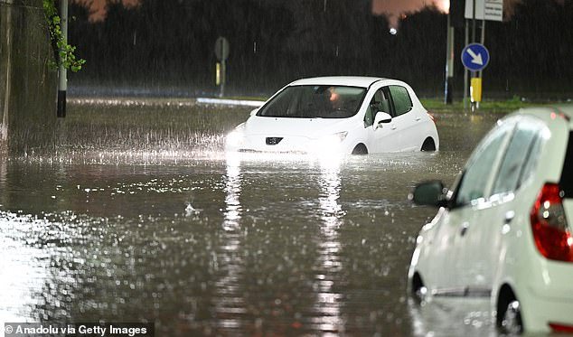 Cars partially submerged after heavy rain caused flooding in Florence, Italy on November 2, 2023