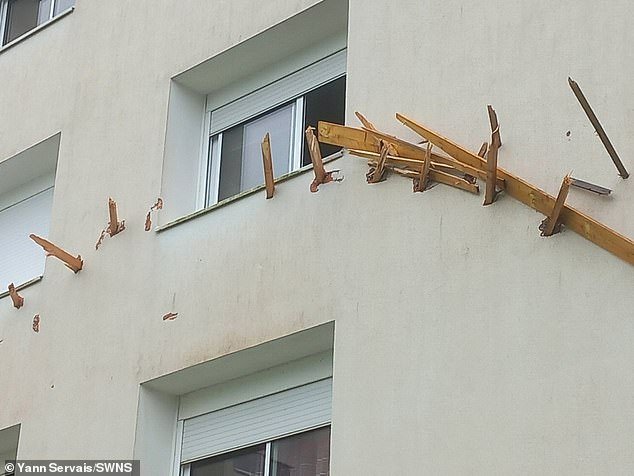 Wooden planks were inserted into the wall of a French apartment building on November 2, 2023