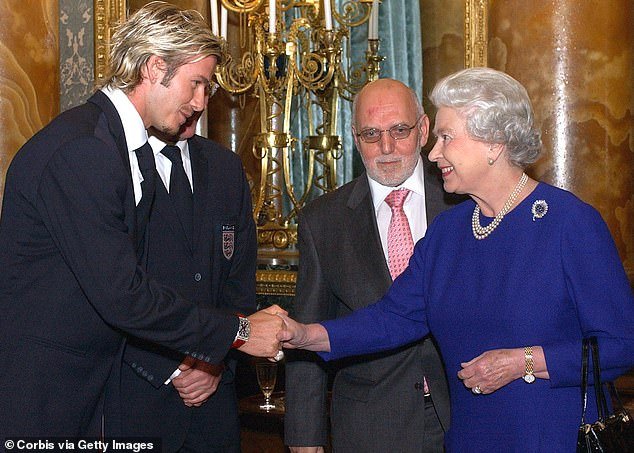 David takes a bow to meet Queen Elizabeth at an FA reception
