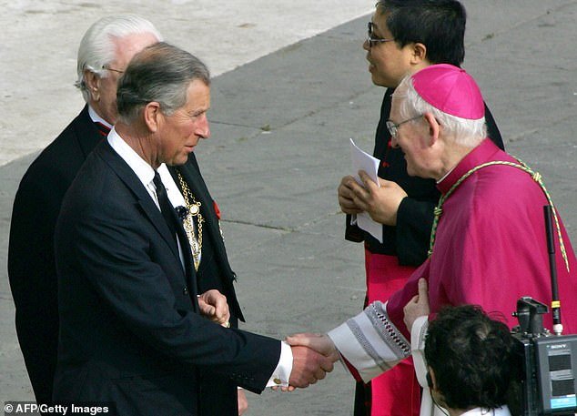Bishop James Harvey welcomes Prince Charles before the funeral of Pope John Paul II in St. Peter's Square, Vatican City in April 2005