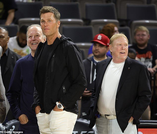 Gray, Brady and Davis watch players warm up during halftime of a Sun-Aces WNBA game