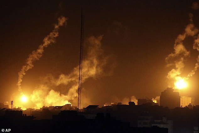 Flares from Israeli attacks light up the sky in northern Gaza on Saturday evening