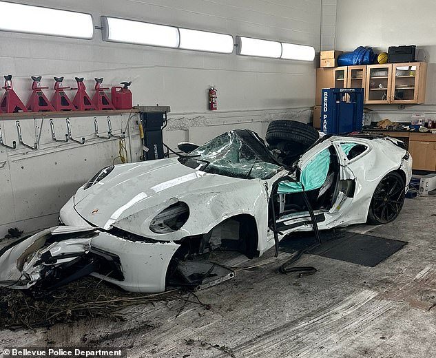 The mangled wreckage of the Porsche 911 after it flew off the highway at more than 100 miles per hour