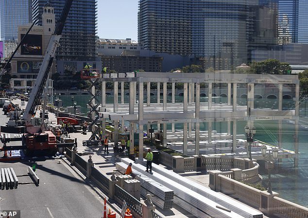 Workers stand at a Formula 1 construction site near the Bellagio Fountains on Monday, September 25, 2023