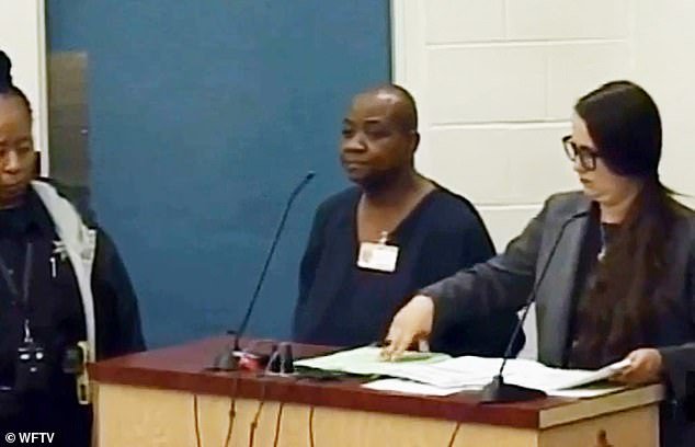 Hodge, pictured in court after her arrest, is charged with interference with custody and neglect of an adult with a disability