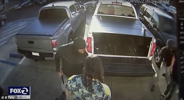 Two armed men try to carjack a vehicle, seen on CCTV footage
