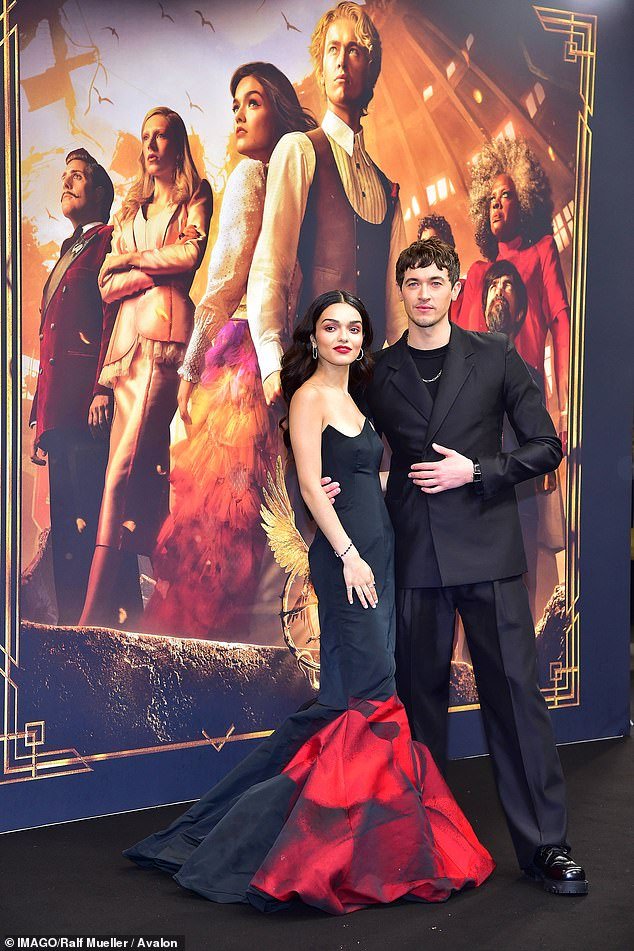 Tribute: The actress, 22 (seen posing with co-star Tom Blyth) paid tribute to original Hunger Games lead star Jennifer Lawrence (who played Katniss Everdeen) in a sleeveless black and red mermaid tail dress