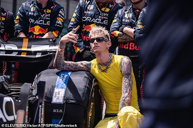 Grand Prix: The American rapper, 33, also known as Colson Baker, was stopped by the driver turned announcer for a gridwalk interview before Sunday's race