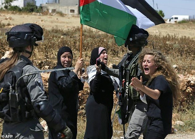 Ahed Tamimi reacts in front of Israeli forces during a demonstration on May 26, 2017 in her village of Nabi Saleh, north of Ramallah, in the Israeli-occupied West Bank