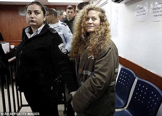 In 2018, Tamimi agreed to plead guilty to four of the 12 charges against her, including assault, sedition and two counts of obstructing soldiers.  In the photo: Tamimi during the process