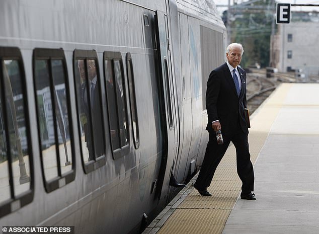 Then VP candidate Biden arrives by train at the Amtrak station in Wilmington that now bears his name in this 2008 file photo