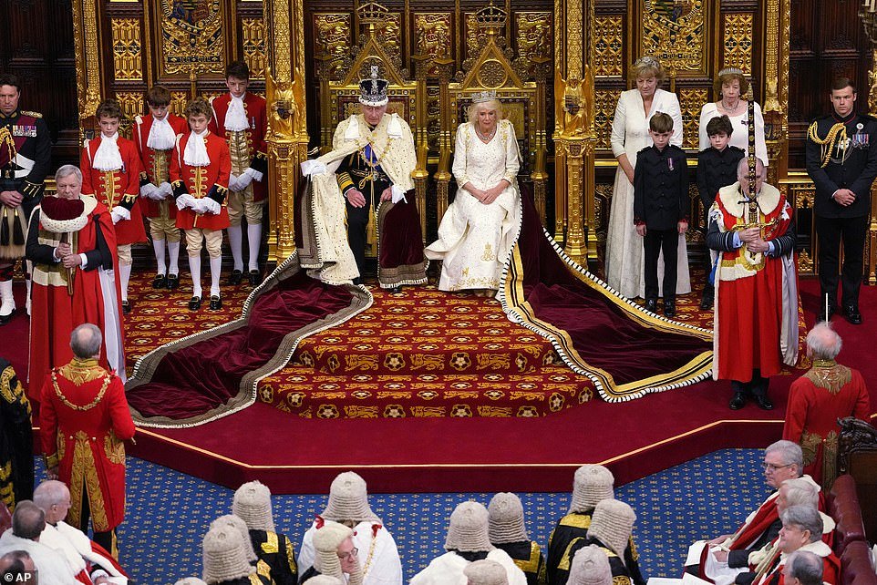 King Charles III sits next to Queen Camilla during the State Opening of Parliament at the Palace of Westminster in London
