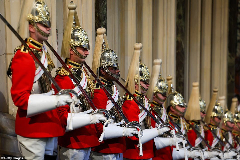Members of the Household Cavalry stand guard at the Norman Porch prior to the State Opening of Parliament