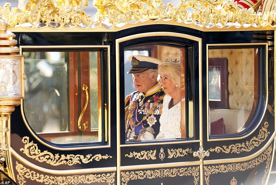 His Majesty and Queen Camilla traveled from Buckingham Palace to Westminster in the Diamond Jubilee State Coach, with the Imperial State Crown carried in front of them