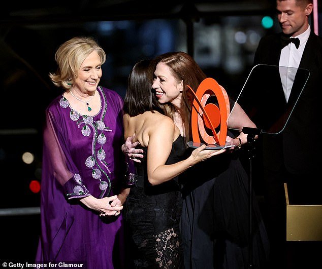 The Clintons presented actress America Ferrera with one of the iconic magazine's awards.  Chelsea Clinton (right) is seen here hugging Ferrera (center) as Hillary (left) looks on