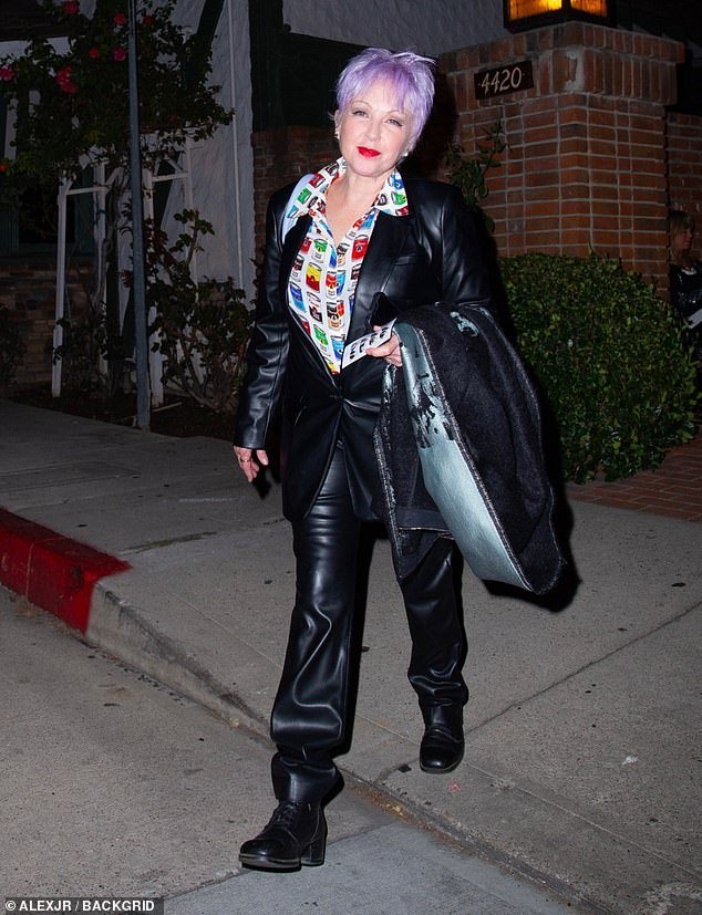 Edgy: Time After Time hitmaker Lauper wore a patterned blouse, leather jacket and sweatpants as she arrived at the venue