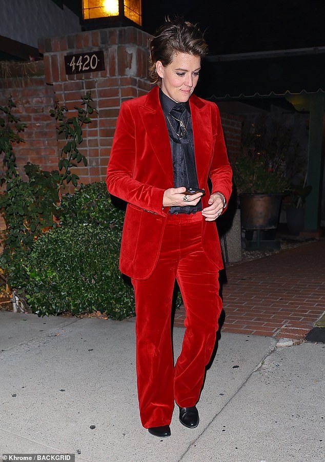 Style: Singer Brandi Carlile, 42, was also in attendance and looked sharp in a crushed red velvet suit and black blouse