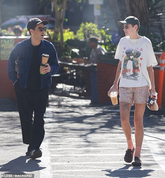 Casual-chic: As the Emmy winner walked around, he could be seen enjoying a chat with his new love.  By his side, Corrin – who came out as non-binary in 2021 – looked casual and comfortable in a white graphic T-shirt and lavender patterned shorts