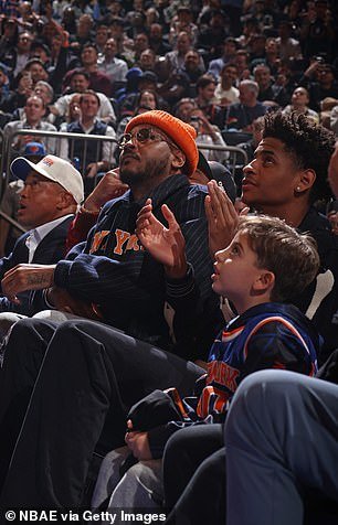 Carmelo Anthony sat courtside with his son and top high school basketball recruit Kyian