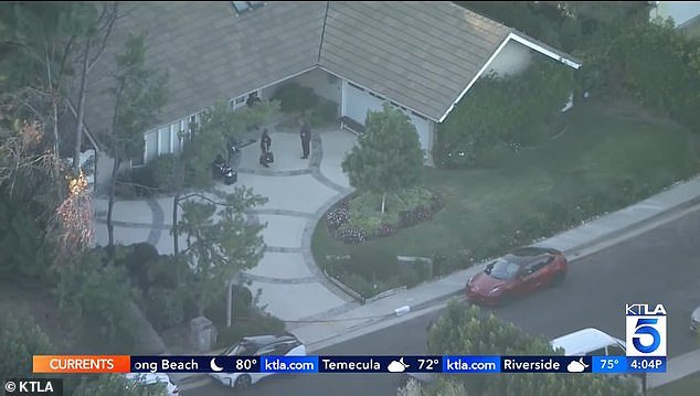 Police, along with Mei's parents, search the $2.5 million, six-bedroom home where the Haskells lived