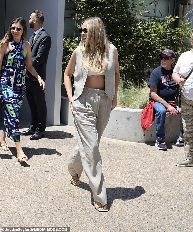 Margot looked happy and confident as she walked out of the chic bar and restaurant
