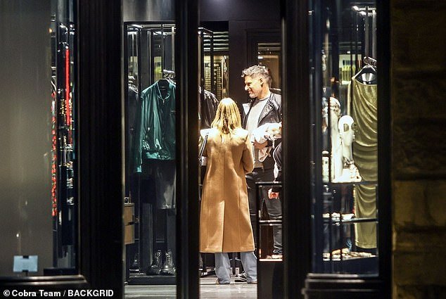 Shopping: The couple made several stops during their night on the town, at one point stopping to check out items at a clothing store