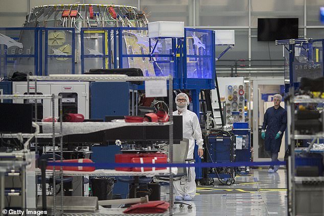 Musk doesn't like bright colors and has even had yellow machines painted black or blue, while yellow security tape has been replaced with red.  Pictured, inside of SpaceX in Hawthorne, California
