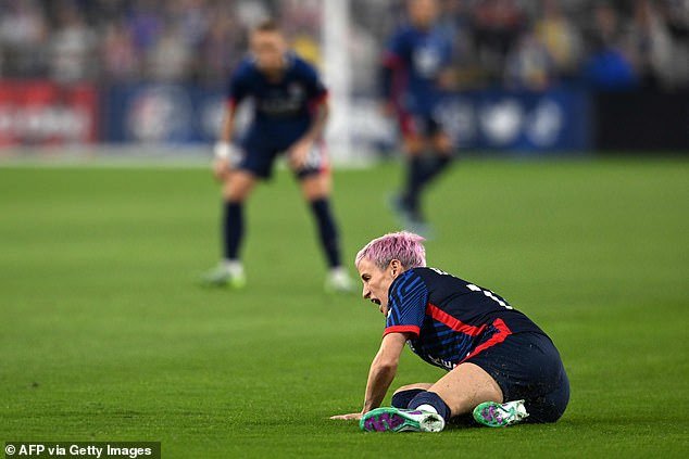 Rapinoe appeared to pinch her leg slightly and appeared to be in pain on the ground