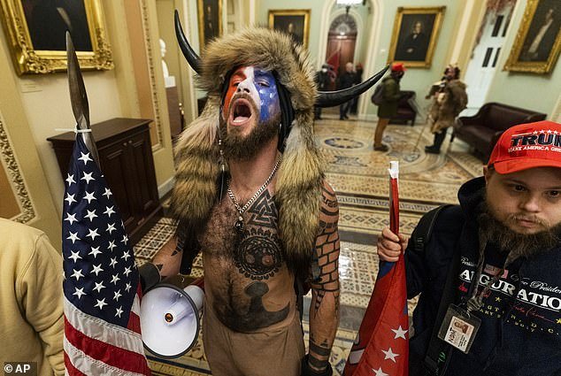 'QAnon Shaman' Jacob Chansley, with his megaphone, is seen at the Capitol on January 6, 2021