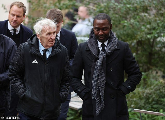 Former United players Paddy Crerand (left) and Andrew Cole arrive to pay their respects