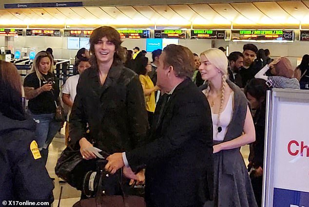 Nice style: They both looked nice dressed for the travel day.  Taylor-Joy wore a white tank top that showed off her sculpted arms.  She added an ankle-length skirt, paired with sleek black boots.  The viewer's platinum locks are expertly styled with Swedish braids