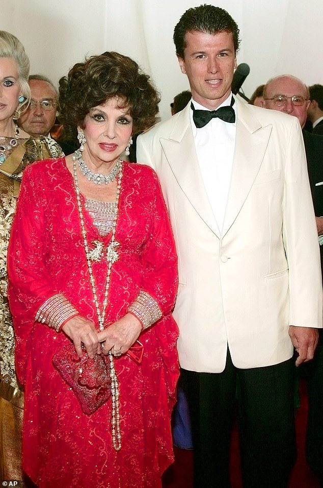 Gina Lollobrigida and ex-husband Javier Rigau Rifols pictured at the 56th Red Cross Ball in 2006. The couple - who had a 34-year age difference - announced their engagement that year