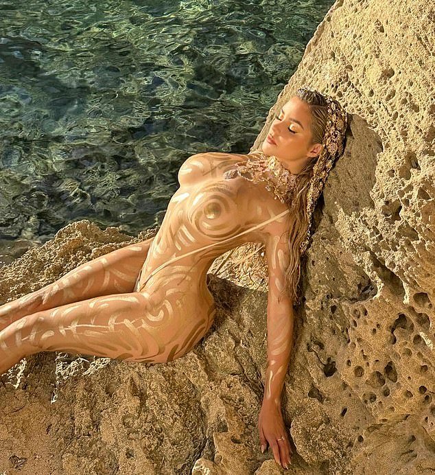 Not one to shy away, the star treated fans with a photo of her bum and tiny torso as she sat on the side of a rock, on top of the crystal clear water