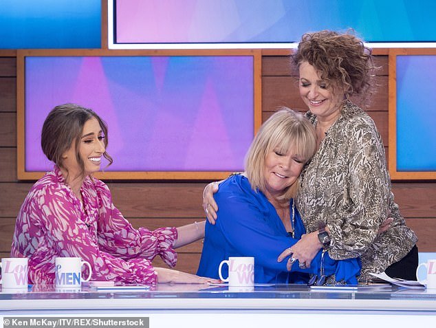 Comforted: Linda became dependent on alcohol in 2018, had to go to rehab three times and took a year off from Loose Women, making an emotional return in January 2020 (pictured with Stacey Solomon and Nadia Sawalha)