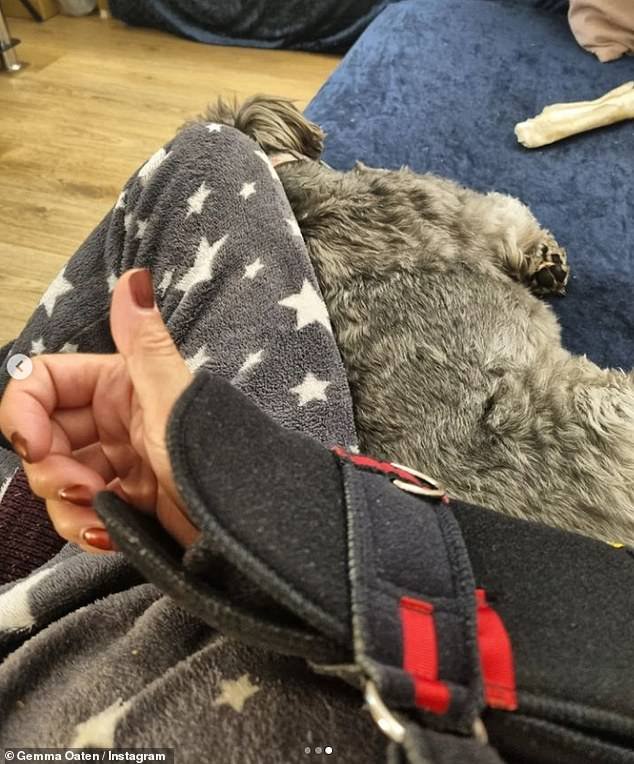 Recovering: Gemma shared a quick selfie of her arm in the sling as her dog slept during her nap