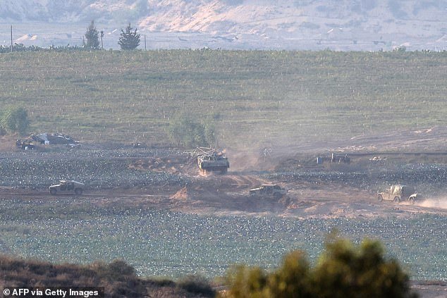 An Israeli armored military vehicle patrols the Gaza Strip on Friday
