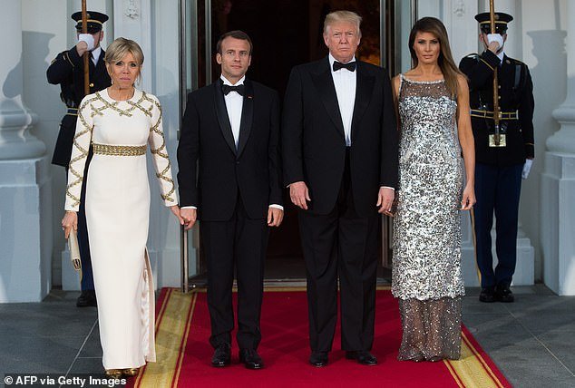 Then-President Donald Trump and First Lady Melania Trump welcome French President Emmanuel Macron and his wife Brigitte Macron for a state dinner in April 2018