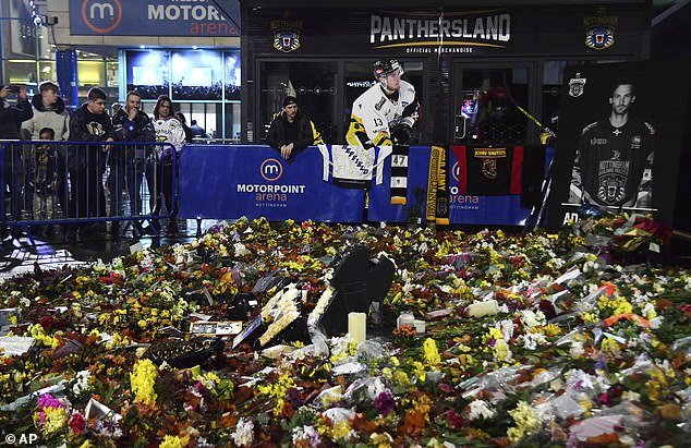 Flowers, cards and jerseys were left outside the venue as emotions ran high before the game