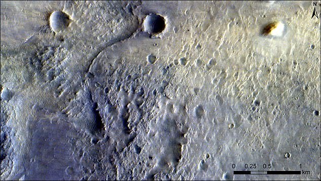 Planetary features are distinct characteristics or elements found on or within a planet's surface.  (Pictured: craters on the surface of Mars)